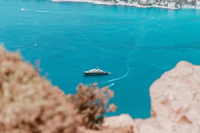 High angle view of boat sailing in sea