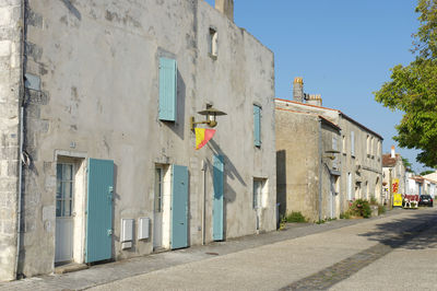 Road amidst buildings in city