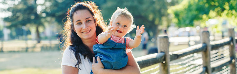 Portrait of mother and daughter outdoors