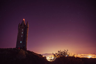 Low angle view of scrabo tower against sky at night