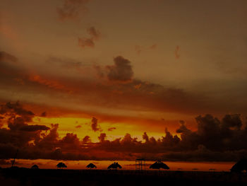 Silhouette trees against sky during sunset