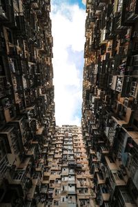 Low angle view of buildings in city against sky