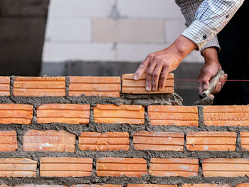 Man working on stack of firewood