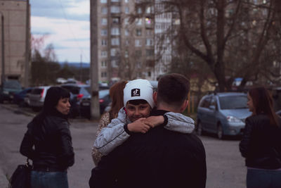 People standing on street in city