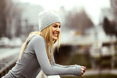 Portrait of smiling young woman outdoors