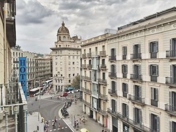 People on city street amidst buildings