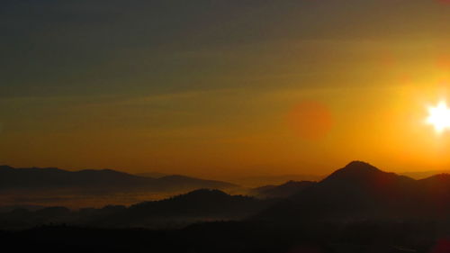 Scenic view of mountains at sunset