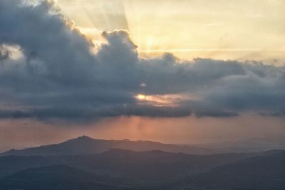 Scenic view of landscape against cloudy sky