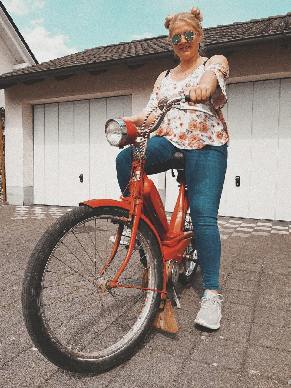 full length, real people, casual clothing, one person, bicycle, lifestyles, architecture, portrait, transportation, building exterior, leisure activity, land vehicle, built structure, looking at camera, women, day, standing, young adult, fashion, outdoors, hairstyle, beautiful woman