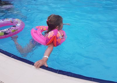 High angle view of girl in swimming pool