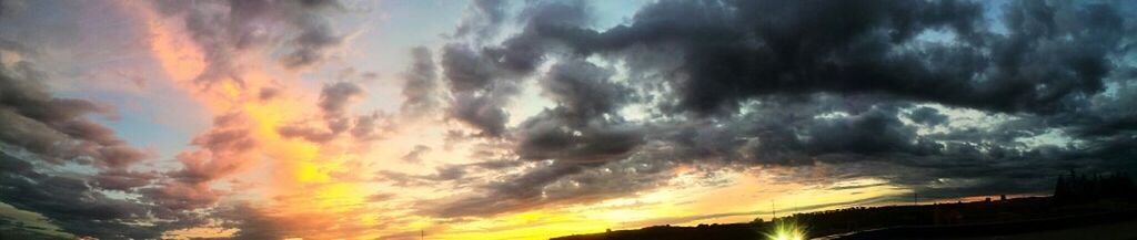 Low angle view of cloudy sky at sunset