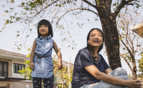 Asian little daughter and her mom in the park. concept for family relationship and relaxing time.