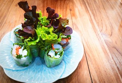 High angle view of vegetables in plate on table