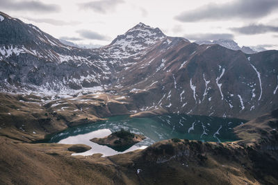 Scenic view of snowcapped mountains against sky