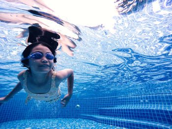 Woman swimming in pool
