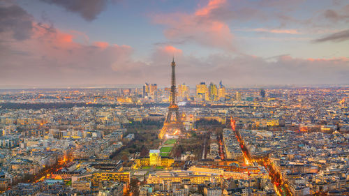 Aerial view of city buildings during sunset