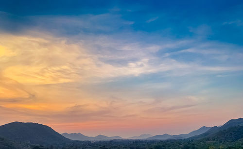 Scenic view of mountains against sky during sunset