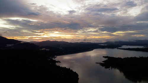 Scenic view of lake against sky during sunset