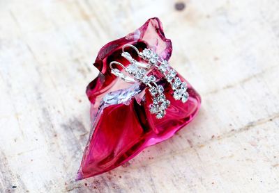 Close up of diamond earrings on red crystal