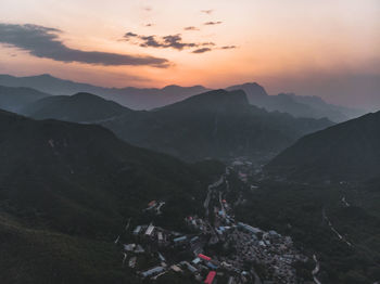 High angle view of mountains against sky during sunset