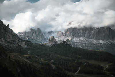 Scenic view of mountains against cloudy sky