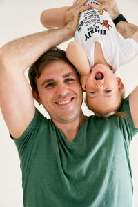 Portrait of father and smiling baby