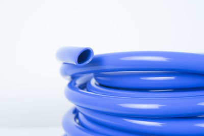 Close-up of blue toy over white background