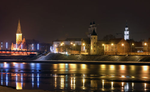 Illuminated buildings in city at night