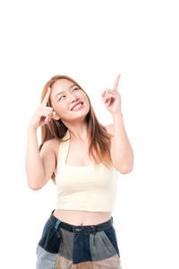 Portrait of a smiling young woman against white background