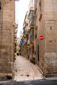 Ancient traditional houses in a narrow street in valletta, malta