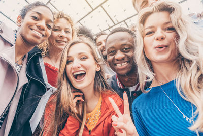 Multi-ethnic friends standing outdoors