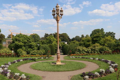 View of fountain in park against sky