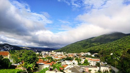 High angle view of town against cloudy sky