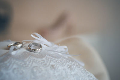 Close-up of rings on white fabric