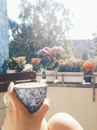 Close-up of woman holding tea cup