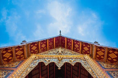 Low angle view of historical building against blue sky