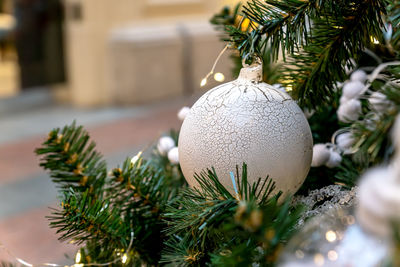 Close up of christmas trees decoration with toys and garlands. festive greeting card for winter 