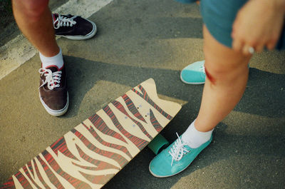 Low section of people standing on road