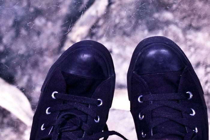 shoe, close-up, personal perspective, footwear, lifestyles, standing, jeans, men, leisure activity, low section, sky, canvas shoe, unrecognizable person, outdoors, day, pair, person, focus on foreground