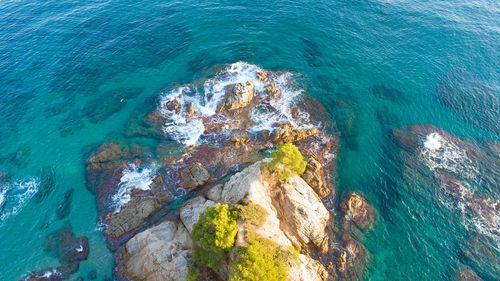 High angle view of rock formation in sea