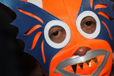 Close-up portrait of man wearing mask