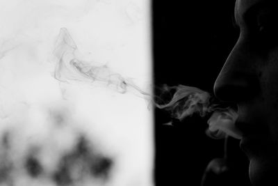 Cropped image of woman smoking