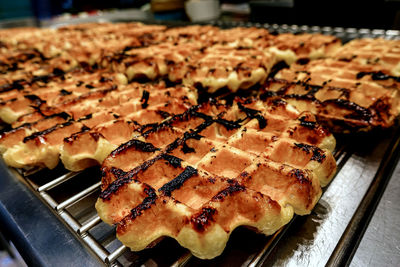 Close-up of waffles on grill