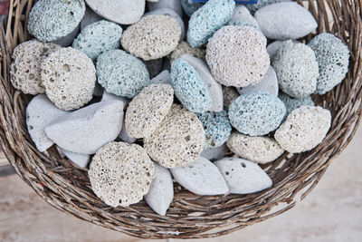 High angle view of multi colored pebbles in basket
