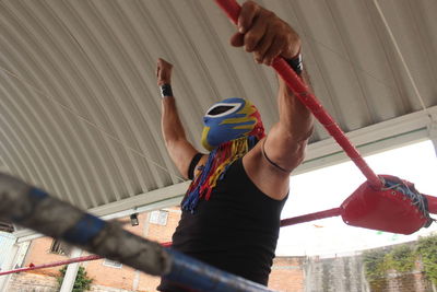 Low angle view of man standing in factory