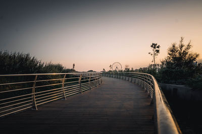 Low angle view of bridge against sky during sunset