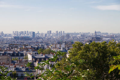 High angle view of city buildings against sky