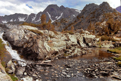 Scenic view of rocks and mountains against sky