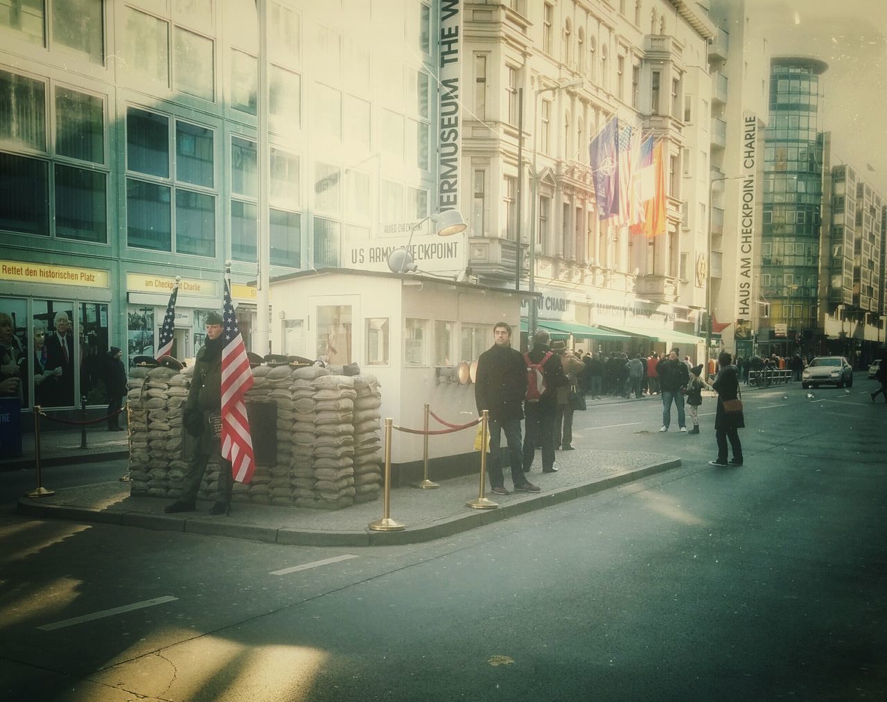 building exterior, architecture, built structure, city, street, city life, building, road, walking, city street, office building, road marking, men, incidental people, transportation, person, day, modern, zebra crossing