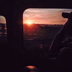 Silhouette of woman at sunset